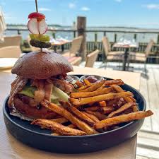 Shell & Bones Restaurant signature dishes Raw oysters, Surf and Turf, Crab Cake BLT